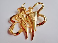 "Striking gold tone large JJ Jonette Art Deco elegantly dressed couple out for a night out on the town. This statement brooch measures 2 3/4\"H X 2 1/2\"W. Signed JJ. Mint condition." Retro Gold Brooch For Anniversary, Gold Art Deco Brooches For Evening, Gold Art Deco Brooch For Evening, Gold Brooch Pins For Party, Gold Lapel Pin For Party, Retro Gold Collectible Pins, Gold Retro Wedding Brooches, Vintage Gold Pins For Party, Retro Gold Brooch For Evening