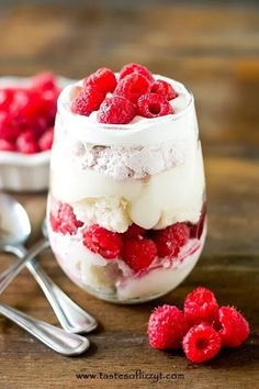 raspberry trifle in a jar with spoons on the side and another dessert in the background