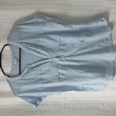 Lucky Brand Light Blue Tee With Two Pockets At The Front Chest Area. Linen Type Woven Fabric At Front From The Pockets Down With Cotton Modal Tee At Top And Back Of Shirt. Button Placket In Front. Laundered But Never Worn. Made Of 60% Cotton And 40% Modal. Woven Part Of Tee Is 100% Cotton. Casual Light Wash V-neck Top, Blue Button-up T-shirt For Summer, Light Wash Tops With Button Closure For Spring, Light Wash Buttoned Tops For Day Out, Light Wash Button Top For Day Out, Light Blue Casual V-neck Shirt, Casual Light Blue V-neck Shirt, Blue Buttoned T-shirt For Summer, Light Wash Short Sleeve Casual Blouse