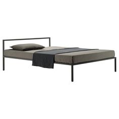 the bed frame is made up with two pillows on it and one side has a black metal frame