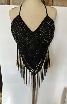 Fabulous and fun club wear belly dancing disco halter. A bit of stretch with lining and molded cups, fits small to large. Excellent condition, appears to be missing 3 or 4 rhinestones, not noticeable. Bohemian Triangle Top Halter For Party, Sequin Halter Neck Top For Club, Sequined Halter Neck Top For Club, Bohemian Halter Neck Tops For Party, Black Triangle Top Crop Top For Festival, Black Triangle Crop Top For Festival, Festival Embellished Sleeveless Crop Top, Black Bohemian Halter Top For Party, Embellished Sleeveless Crop Top For Festival