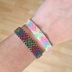 a person wearing a colorful bracelet on their arm