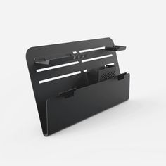 a black desk organizer with two compartments on the front and one is open to show files