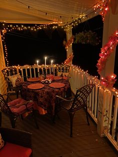 an outdoor dining area is decorated with string lights