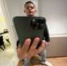 a blurry image of a person holding a tablet