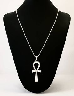 Royal Ankh Necklace, Egyptian Ankh Pendant, Sterling Silver Ankh Necklace, Large Ankh Pendant, Egyptian Revival Necklace, Ankh Jewelry.The Egyptian ankh necklace carries a powerful message, literally meaning “the breath of life”. This Egyptian revival pendant is considered a key to life, as it offers you a powerful union. Bringing together feminine and masculine aspects that are contained in their form. Creating a never-ending circuit of energy, that helps ensure a boost in energy on a day to da Ankh Necklace Silver, Handmade Silver Ankh Necklace, Silver Ankh Symbolic Necklace, Silver Ankh Amulet Necklace, Silver Ankh Necklace For Ceremonial Use, Silver Ankh Necklace For Ceremonial Occasions, Handmade Ankh Necklace For Ceremonial Occasions, Traditional Ankh Necklace For Gifts, Traditional Cross Necklace With Large Pendant