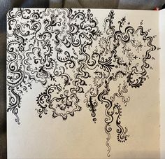 an intricately designed piece of paper with black ink