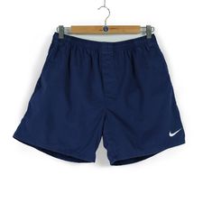 Welcome to our shop. We are waiting for your wishes, also don't be afraid to ask any questions. If you like something from our clothes, just add  to favourites or write to us. Follow us on instagram - @cashalot.store  - ITEM -  90s Vintage men's NIKE small swoosh navy blue cotton shorts Size M retro sportswear activewear relaxed made in Indonesia - SIZE - Size Label (M)  Waist band - 14,2 - 18,1 (min36-max46cm) Length - 15,7 (40cm) Leg Opening - 11,8 (30cm) (all our items are measured laying flat) - CONDITION -  Total condition 8.5/10 Please check all Photos , also i can make detailed photos All needed questions ask before buying! - DELIVERY INFO - * All the parcels have a tracking number * All the items will be shipped after successful payment transaction within 1-3 business days. * Inter Navy Sports Shorts, Cheap Vintage Blue Shorts, Navy Short Sportswear Bottoms, Blue Cotton Shorts, Vintage Blue Sports Shorts, Navy Sportswear Bottoms With Built-in Shorts, Sportswear Activewear, Retro Sportswear, Size Label