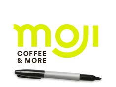 the logo for moji coffee and more, with a pen on top of it