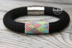 the bracelet is decorated with multicolored squares