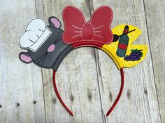 Mouse Cook Mouse Ears Mouse Ears on Headband--Perfect for your vacation or special event. Embroidered on marine vinyl. Is on a satin covered plastic 3/8" headband. Can easily be changed out and put on  a different headband if needed.  Comes from a smoke free home and a pet free room. All items, except custom orders, are returnable. Must be returned within 7 days and I will issue a refund for the price of item. All shipping charges will be paid by the buyer. Ratatouille Mouse Ears, Disney Ears Ratatouille, Embroidered Mickey Ears, Mouse Headband, Mouse Ears Headband, Ears Headband, Disney Ears, Ear Headbands, Mouse Ears