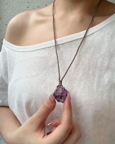 Discover our Crystal Healing Macrame necklace. AMETHYST is known for its calming, clarifying, and protective properties. It helps reduce stress, enhances mental clarity, and shields against negative energies. This beautiful purple crystal is also believed to promote spiritual growth and inner peace, immersing you in serene tranquillity. Amulet Style Macrame Pendant Necklace, Macrame Amulet Pendant Necklace, Macrame Pendant Amulet Necklace, Spiritual Macrame Pendant Necklace, Bohemian Crystal Pendant Necklace With Adjustable Cord, Holistic Jewelry With Adjustable Cord For Meditation, Spiritual Purple Macrame Jewelry, Spiritual Necklace With Adjustable Cord, Purple Bohemian Necklaces For Healing