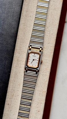 A classic Seiko Lassale piece with gold plated case. Case size 16x24mm, bracelet is 18cm long, fits 17cm wrist size or smaller. The pictures include a photo of the item next to a measuring tape. It is recommended to measure your wrist for comparison before purchase as the older watches are typically smaller than the modern models. Movement: Seiko Quartz. Working and keeping time. Links can be removed. In good condition. Some minor wear on case not noticeable. Very good vintage condition  Sold as Retro Gold Watch With Rectangular Dial, Retro Gold Watches With Rectangular Dial, Vintage Rectangular Analog Watch Accessories, Vintage Rectangular Watch Accessories, Collectible Gold Watch With Rectangular Dial, Retro Gold Rectangular Watches, Vintage Rectangular Watch With Metal Dial, Old Watches, Measuring Tape