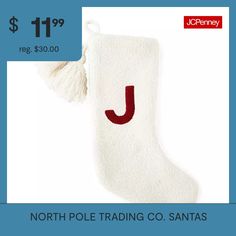 a white christmas stocking with the letter j on it and a tassell hanging from