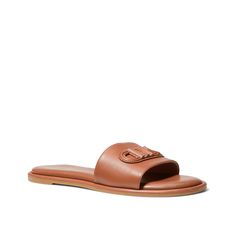 Michael Kors-Saylor Sandal Grabbing coffee with friends? Give your casual look a chic twist with the Michael Michael Kors Saylor sandal. The slide sandal, made using sustainable leather, has a debossed empire patch that can elevate any look. Trendy Brown Leather Slides, Leather Sandals For Spring Travel, Leather Sandals For Travel And Spring Season, Brown Slides For Everyday Spring Wear, Brown Spring Slides For Everyday Wear, Brown Slides With Leather Footbed For Everyday, Brown Sandals With Removable Insole For Travel, Brown Trendy Sandals For Everyday Wear, Trendy Brown Sandals For Everyday