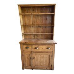 an old wooden hutch with drawers and cupboards