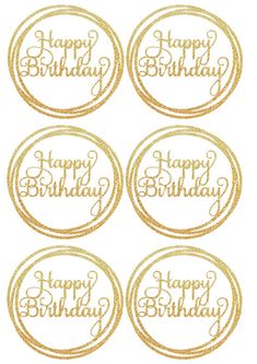 four gold happy birthday stickers with the words happy birthday written on them in cursive writing