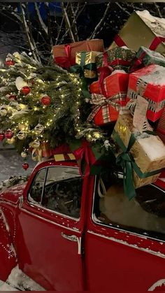 a red car with presents on the roof