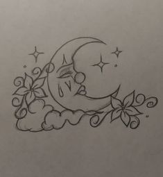 a drawing of a crescent moon with stars and flowers on it's side,