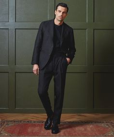 Inspired by all the classic elements of a chino, our design team created the Madison Suit Pant as a casual take on the tailored, pleated trouser. A natural waist leads to a relaxed fit through the hips and thighs before tapering at the calf. It’s crafted from a black Italian linen that comes to us from the famed Sondrio Mill and is made for year-round wear. Pull on a pair to elevate a humble hoodie or tee, or top with a dress shirt and a sport coat (like the matching suit jacket, perhaps) for a Suit With Black Pants Men, Suits Jacket Men's, Engagment Outfit Mens, Formal Attire For Men Black, Mens Welcome Party Outfit, Black Wedding Guest Attire Men, Men Wedding Aesthetic, Black Wedding Guest Outfit Men, Black Tie Wedding Mens Attire