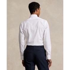 This polished shirt is crafted with 120s-quality two-ply cotton poplin and features our signature embroidered Pony. Formal Poplin Tops With Spread Collar, Formal White Poplin Tops, White Poplin Tops For Formal Occasions, Fitted Poplin Shirt For Office, Elegant Poplin Business Shirt, Elegant Business Poplin Shirt, Classic Fitted Ralph Lauren Dress Shirt, Tailored Cotton Dress Shirt With Concealed Placket, Elegant Poplin Dress Shirt For Formal Occasions