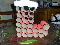 a stack of toilet paper tubes sitting on top of a table