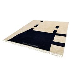 a black and white rug with an abstract design on the bottom, in front of a white background