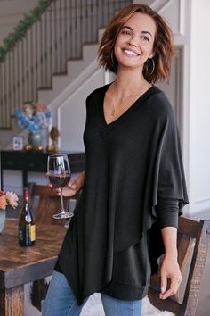 An easy-elegant tunic with cape-like overlay on one side, V-neck and raglan sleeves. Tunic Tops With Jeans, Tops With Jeans, Poncho Wrap, Embroidered Tunic Top, Zippered Sweater, Caftan Dress, Embroidered Tunic, Knitted Poncho, Soft Surroundings