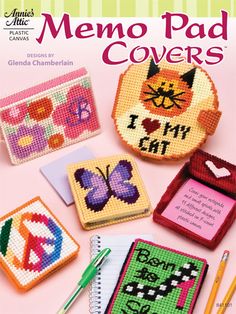 a book cover with cross stitched items on it and the title, memento pad covers