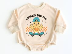 Chicks Dig Me Easter Bubble Romper Sweatshirt, Easter Baby Outfit, Baby Boy Easter Outfit, Baby Bodysuit, Baby Easter Outfit, Easter Shirt 💗  Welcome to The WildflowerbyMiley Etsy Shop!  This listing is for the bodysuit, sweatshirt or t-shirt only. All other items that are shown in our photos such as shoes, hats, beanies, blankets etc. are for photo staging purposes and are NOT INCLUDED in the sale. DESCRIPTION:  This baby and children's unisex essential fits like a well-loved favorite. Super s Cute Onesie With Letter Print For Playwear, Cute Graphic Print Onesie For Playwear, Unisex Cute Onesie With Graphic Print, Cute Long Sleeve Onesie With Graphic Print, Cute Graphic Print Onesie For First Birthday, Easter Baby Outfit, Boy Easter Outfit, Baby Boy Easter Outfit Infants, Baby Boy Easter