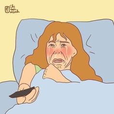 a woman laying in bed holding a remote control