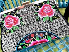 Beautiful Mexican embroidered floral design clutch with cotton strap. Two pockets inside and comes with black removable strap. 11in x 7in Black Bags With Floral Embroidery For Spring, Spring Evening Clutch Embroidered, Spring Evening Embroidered Clutch, Black Clutch Bag For Spring, Spring Multicolor Shoulder Bag With Floral Embroidery, Chic Embroidered Summer Clutch, Embroidered Rectangular Shoulder Bag For Spring, Spring Embroidered Rectangular Shoulder Bag, Embroidered Clutch For Evening In Summer