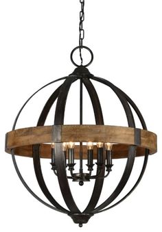 a chandelier made out of wood and metal with an iron ring around it