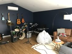 a living room filled with furniture and musical instruments