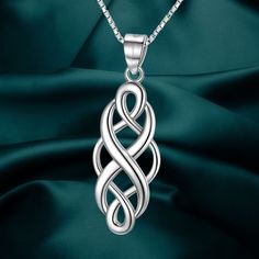 Inspiration: Celtic knots are powerful symbols that have been cherished for centuries. The 8-character part of the Celtic knot in this necklace represents eternity, making it a meaningful and timeless piece of jewelry. Wearing a Celtic knot necklace is believed to bring good luck, and it serves as a heartfelt gift to express infinite love and blessings to the recipient. Material: The necklace is crafted from 925 sterling silver, ensuring its quality and durability. It is also nickel-free, lead-free, cadmium-free, and hypoallergenic, making it safe for those with sensitive skin. The necklace is designed without sharp edges and corners, ensuring comfort and preventing scratches. Size: The pendant of the Celtic Knot Necklace measures 11x33mm, giving it an elegant and noticeable presence. It h Silver Engraved Infinity Necklace, Celtic Knot Cross, Powerful Symbols, Celtic Knot Necklace, Celtic Knot Pendant, Infinite Love, Celtic Knots, Celtic Designs, Knot Necklace