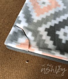 the fabric has been stitched together to make an interesting pattern