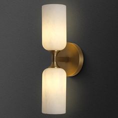 Elevate your home decor with our Round Alabaster Brass Sconce. Expertly crafted from genuine marble, this Country Style wall light offers exquisite craftsmanship and a unique pattern. Its dimmable feature and warm white lighting ensure both functionality and ambiance in any indoor setting. Luminaire selection Fixture Finish: Brass | Luminaire selection LED Plug-in Accent 7.8 H x 9.41 W x 17.28 D in yellow in Brass | 17.28" L x 9.41" W x 7.8" H | Wayfair Modern Wall Sconces Living Room Brass, Vanity Sconces Bathroom, Wall Scone Brass, Bathroom Vanity Sconces, Bathroom Lighting Over Mirror, Gold And Glass Wall Sconces, Wall Sconces Alabaster, Modern Flush Mount Lighting, Black Sconces