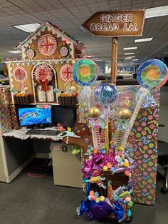 an office cubicle decorated with candy and decorations