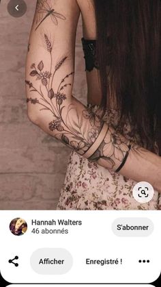 the back of a woman's arm with flowers on it