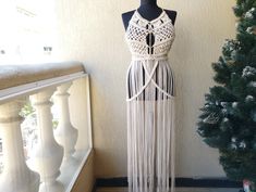 "This macrame dress is made of cotton in White color. You can wear this beautiful hand made dress as a beach wear, festival dress, etc. This boho dress is S-M size Model dimensions: Bust 31\", Waist 24\", Hip 35\"     NOTE: The dress could be only hand washed, just steam ironing. All our items are made to measure, and handmade.  We want to ensure a perfect fit of your individually customized garment, so once you place your order please send us a message with your measurements. (Waist circumferen Fitted White Dress For Festival, White Party Dress For Festivals, White Party Festival Dresses, Beige Tassel Festival Dress, Beige Tassel Dress For Festival, Festival Beige Dresses With Tassels, Sleeveless Fringe Mini Dress For Festivals, Beige Festival Dress With Tassels, Bohemian Fitted Dresses For Party Season