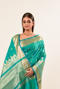 Discover the exquisite light Blue Temple Border Handwoven Katan Banarasi Saree. Perfect for saree enthusiasts, this elegant piece blends tradition with style. Shop now and elevate your collection! Elegant Turquoise Dupatta With Zari Work, Elegant Turquoise Dupatta For Festive Occasions, Elegant Turquoise Traditional Wear For Festive Occasions, Traditional Turquoise Wear With Zari Weaving, Turquoise Saree For Wedding And Eid, Turquoise Banarasi Silk Traditional Wear, Traditional Turquoise Saree With Zari Weaving, Turquoise Traditional Wear With Zari Weaving, Elegant Turquoise Dupatta For Diwali