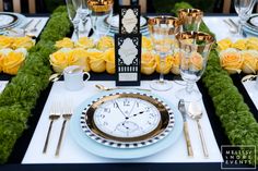 the table is set with yellow roses and place settings for an elegant dinner party or special event