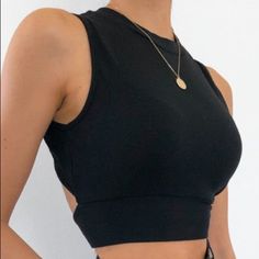 Cotton 35%, Polyester 60%, Spandex 5% Versatile Fitted Black Crop Top, Black Elastane Tank Top For Night Out, Trendy Black Crop Top For Workout, Versatile Black Stretch Crop Top, Fitted Black Workout Tank Top, Trendy High Stretch Black Crop Top, Black High Stretch Crop Top Tank Top, Black Cropped High Stretch Tank Top, Black Stretch Cropped Tank Top