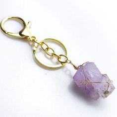 Product Description:Introducing our exquisite Gold-Plated Natural Crystal Raw Stone Keychain, a high-quality accessory that combines the allure of natural crystals with the elegance of gold. Each keychain features a 100% natural crystal adorned with a luxurious gold-plated finish, resulting in a captivating blend of beauty and sophistication. With dimensions ranging from 45-65mm and weighing approximately 0.05kg, our keychains offer a perfect balance of portability and opulent aesthetics.How to Gold Rectangular Keychain For Personal Use, Crystal Keychain, Crystal Energy, Rainbow Fluorite, Energy Crystals, Spiritual Jewelry, Raw Stone, Healing Properties, Natural Crystals