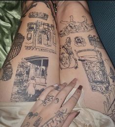 two women's legs with tattoos on them, both showing their hands and fingers