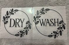 two stickers that say dry wash and have leaves in the shape of wreaths