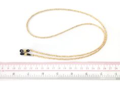 This crystal gold lined eyeglasss holder necklaces are made of Czech Fire Polished beads. It goes well with all your reading glasses and gives you a perfect elegant look, an ideal gift for women. EC019 * Quantity: 1pc * Materials: - 4mm Czech Fire Polished Crystal Gold Lined - Rubber connector * Measurement: Total length 75cm(29.5inch) including adjustable rubber end connectors * Metal Color: Gold * No return or refund for this made to order item. For more eyeglass chains, please visit this link Adjustable Gold Glasses Chain, Adjustable Delicate Gold Glasses Chain, Gold Metal Glasses Chains With Lobster Clasp, Adjustable Gold Glasses Chains With Lobster Clasp, Adjustable Gold Glasses Chains For Gift, Adjustable Gold Glasses Chains As Gift, Eyeglass Chains, Glasses Chains, Eyeglass Holder