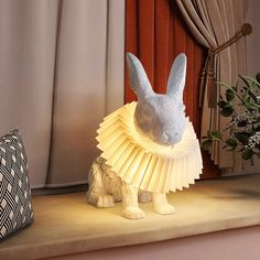 a rabbit lamp sitting on top of a table