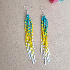 Long Beaded Tassel Earrings,Turquoise Yellow White Iridescent Earrings Handmade very long beaded earrings. Beaded Shoulder Earrings, Elegant Earrings, Gift for Her. Make your day more colorful with some of my items. Each one of them is handmade with a lot of love and positive energy. These unique earrings are the perfect addition to any look. A gift for you or a loved one, a gift for anniversary and birthday. Iridescent earrings in turquoise, yellow and white. You can choose any number of earrin Turquoise Tassel Earrings With Dangling Beads, Turquoise Earrings With Tassels And Round Beads, Turquoise Tassel Earrings With Colorful Beads For Beach, Turquoise Tassel Earrings With Colorful Beads, Turquoise Tassel Drop Earrings With Colorful Beads, Iridescent Earrings, Long Beaded Earrings, Beaded Fringe Earrings, Gift For Anniversary