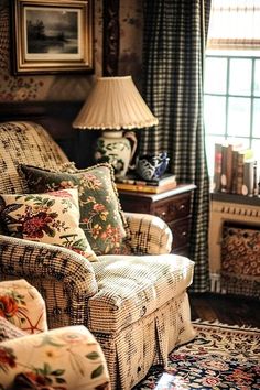 a living room filled with furniture next to a window covered in curtained drapes